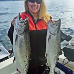 Karen Rhinehart holds up the last of a two fish limit for the season. Those are some nice chunky Blackmouth right there.